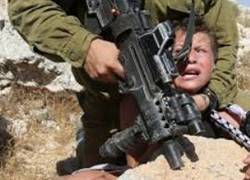 http://www.informationclearinghouse.info/idf-abuse-child.JPG