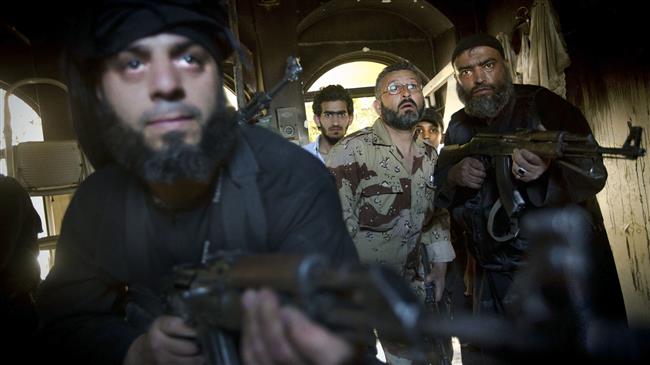 File photo of militants in Syria's Aleppo, 22 May 2013. (Photo by AFP)
