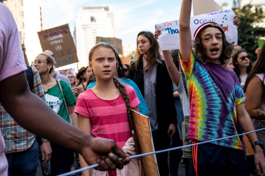 Greta Thurnberg marches with other activists during the climate strike